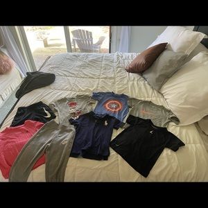 Boys play lot! Under armor, Nike, polo shirts. One Nike pant and Nike short.
